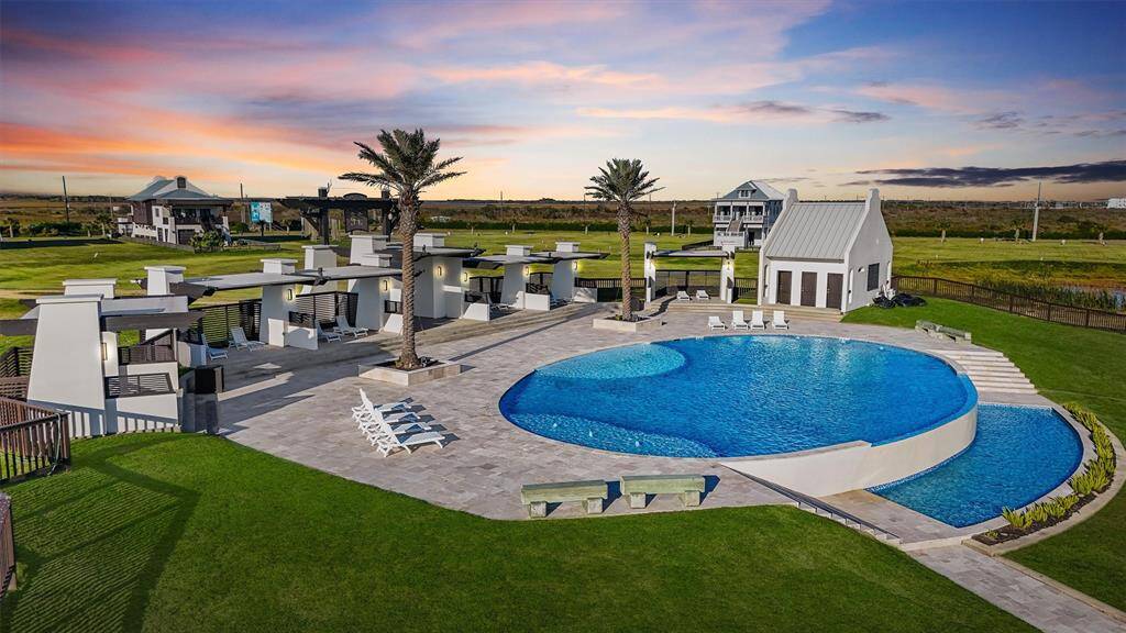 Porch perfection! This coastal retreat is built for relaxation and stunning sunsets. Multiple balconies and outdoor spaces make it easy to soak in the serene surroundings of Seagrass Beach. Your ultimate beachside haven awaits!