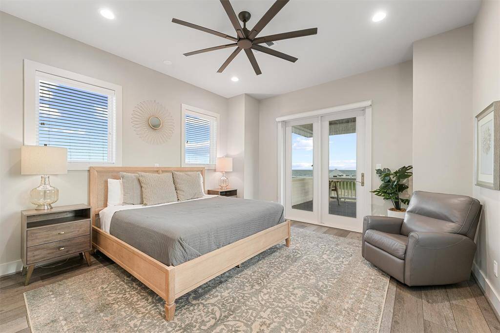 Bright and inviting, this hallway features large windows that bring in natural light and showcase beautiful sky views. Thoughtfully designed to connect comfort and style throughout the home.