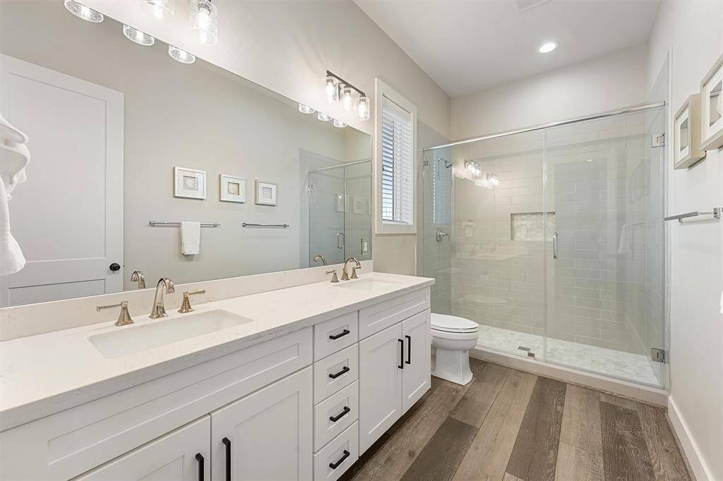 Wake up to serene ocean views in this spacious and stylish primary bedroom. With direct access to the balcony and plenty of natural light, this room is designed for comfort and tranquility.