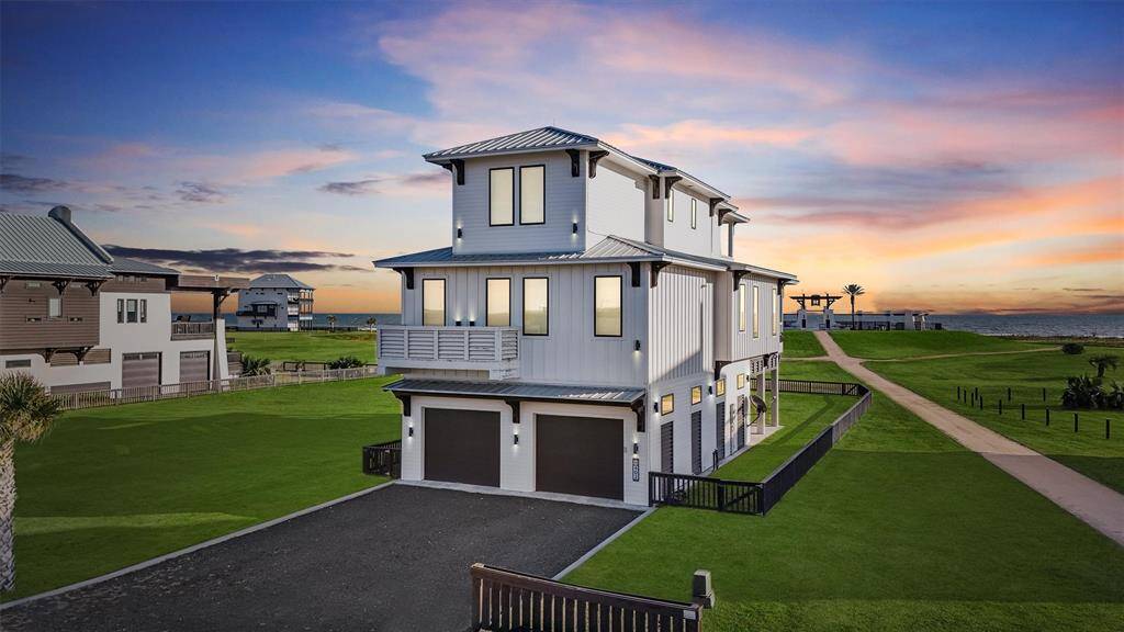 Enjoy the ultimate outdoor lifestyle with this spacious covered patio, perfect for al fresco dining and relaxing in the shade. A great spot to unwind after a day at the beach.