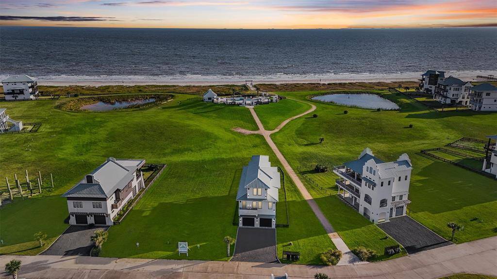 Expansive outdoor space perfect for entertaining, relaxing, or playing. Enjoy coastal living with a large fenced yard and stunning views, just steps away from the beach.