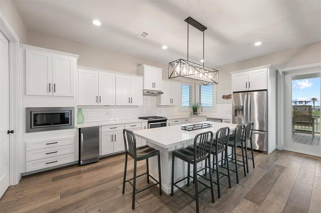 Seamless living at its best. This open-concept design effortlessly connects the kitchen, dining, and living areas, creating a welcoming space for entertaining or spending quality time with loved ones.