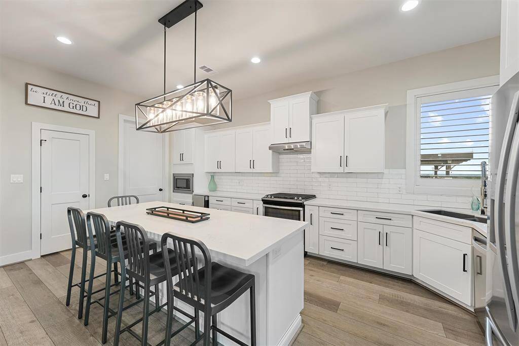 Seamless living at its best. This open-concept design effortlessly connects the kitchen, dining, and living areas, creating a welcoming space for entertaining or spending quality time with loved ones.