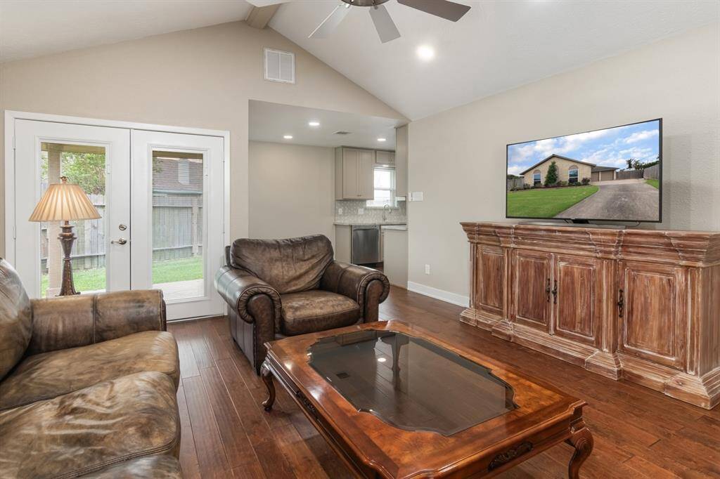 Double doors off the living room to the backyard.
