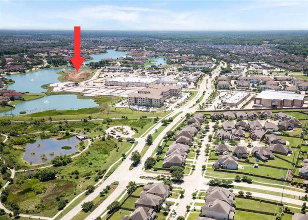 An aerial perspective highlighting the prime location of this lot in Monet Estates, just moments away from Kroger, dining, and shopping options. Enjoy the convenience of having everyday necessities and leisure destinations right at your doorstep, all while living in the tranquil, gated Riverstone community.