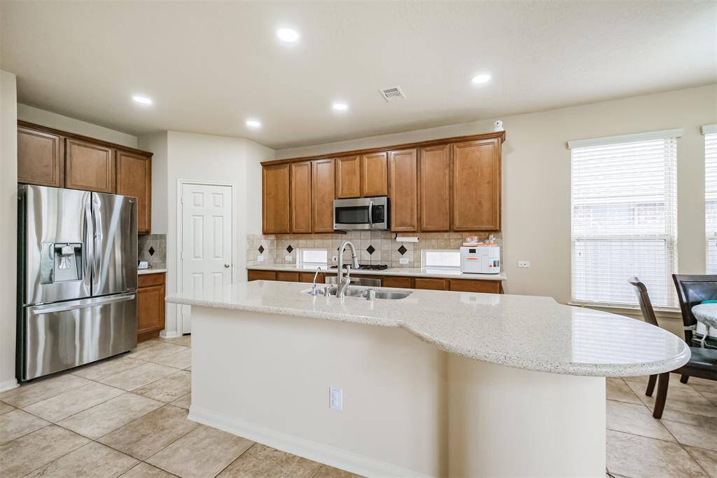 An airy kitchen that overlooks the family room for easy living.
