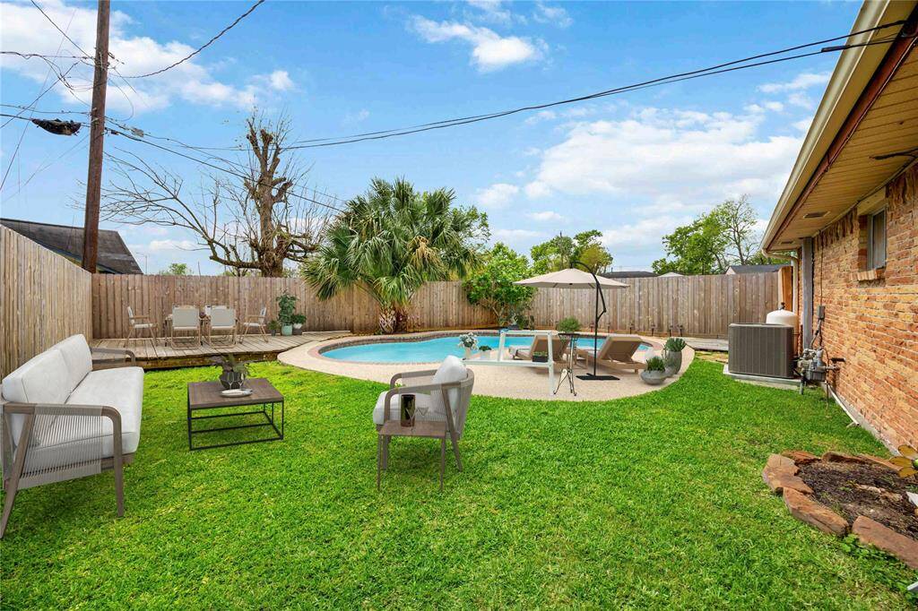 Cool off in your pool on hot summer days! Outdoor furniture is virtually staged