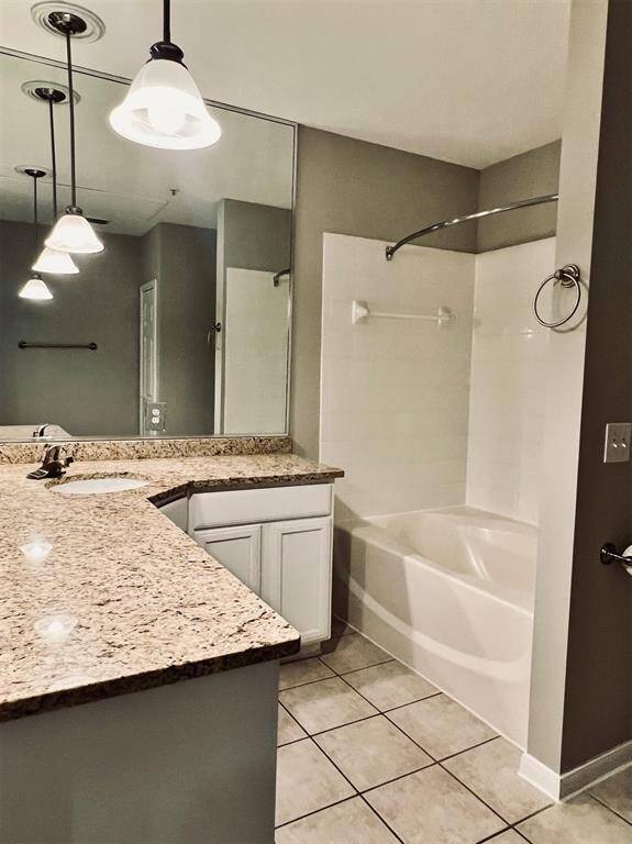 Bathroom has lots of counter space & oversized garden tub.
