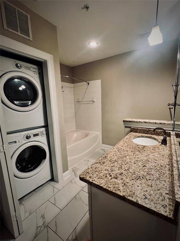 Oversized garden tub & comes with full size washer and dryer.