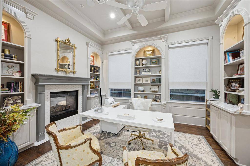 Home Office is complete with built-ins and wood floors