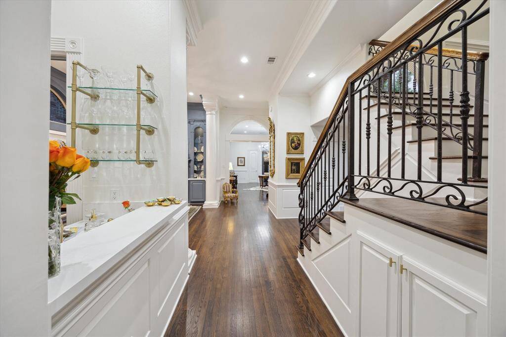 Beautiful wrought iron railings on the stairs overlooking the downstairs space