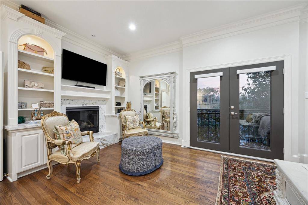 Sitting area complete with built-ins in the Primary Bedroom plus French doors leading to a private balcony