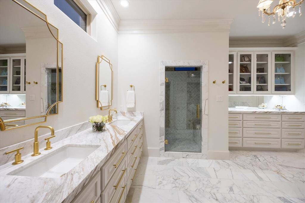 Primary Bathroom bathed in marble is a dream space