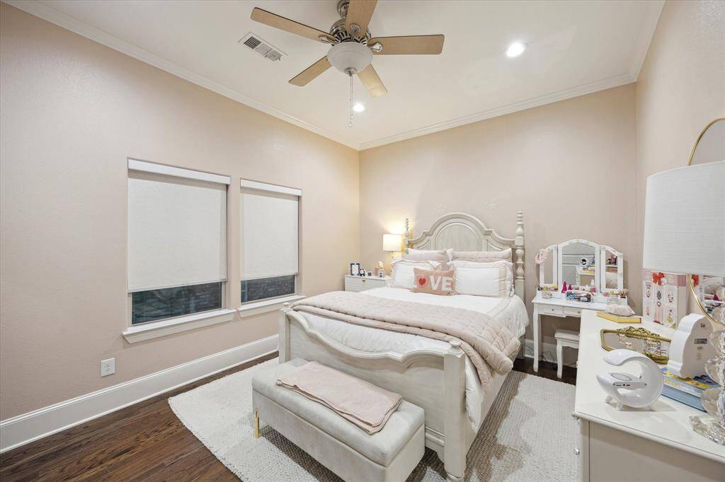 Secondary Bedroom with wood floors and a ceiling fan