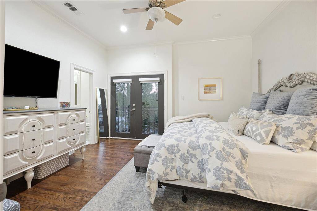 Secondary Bedroom with wood floors and a ceiling fan