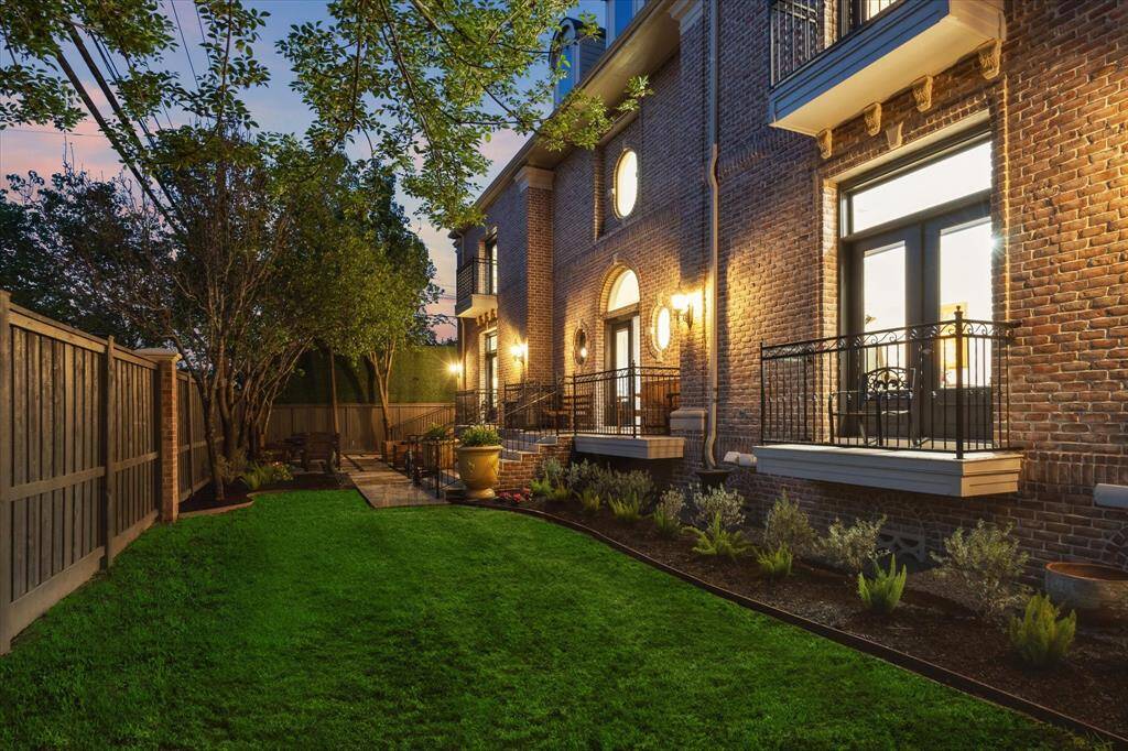 Green space in the side yard before the Patio with the amazing private balconies