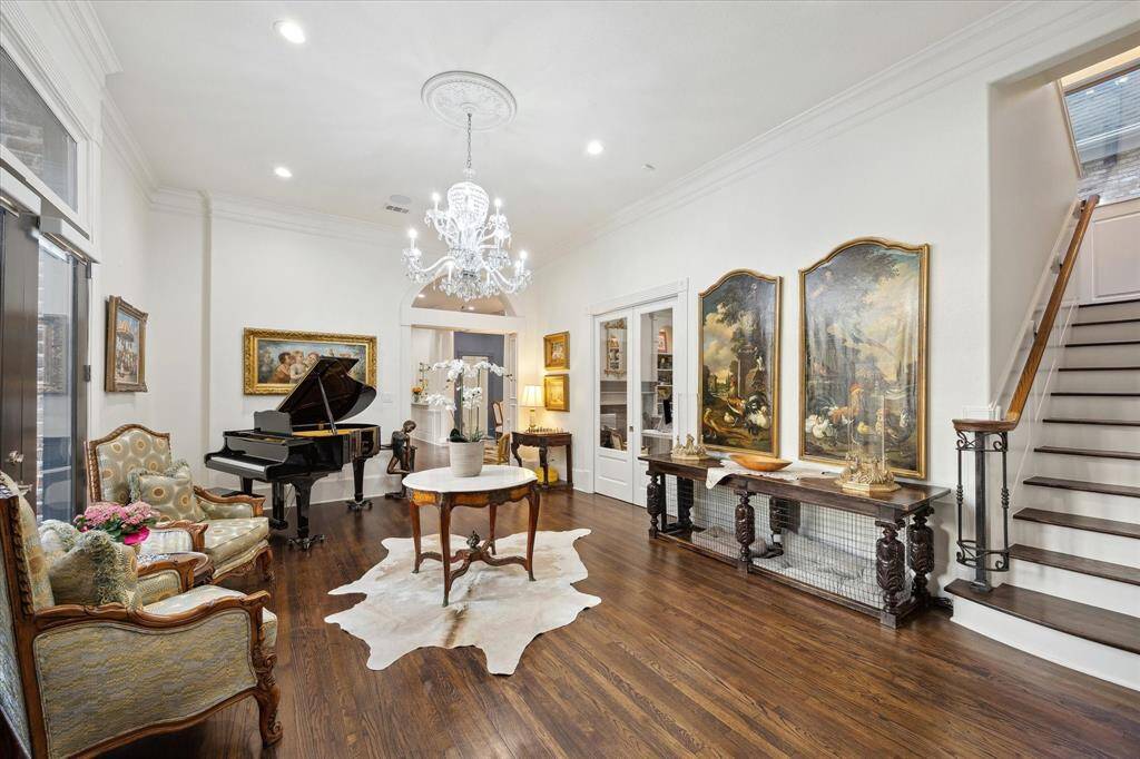 Up the first set of stairs from the Foyer is the Formal Living Room with hardwood floors