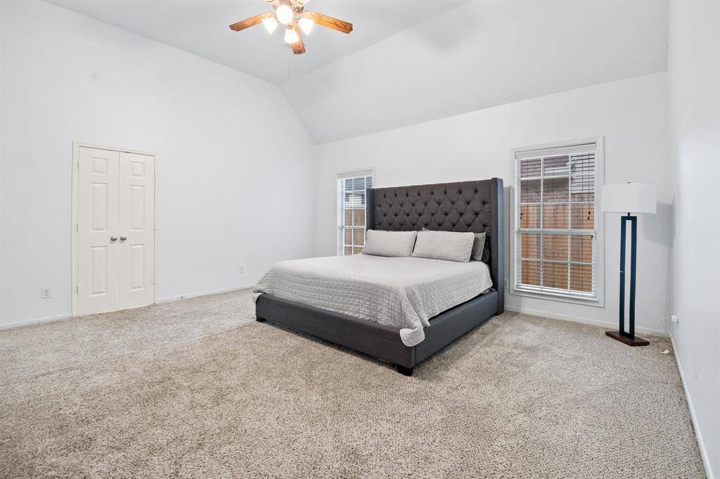 The primary bedroom with lots of space for lots of furniture