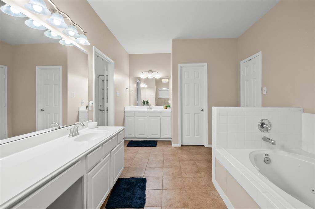 Primary bedroom with dual sink and a huge walk in closet