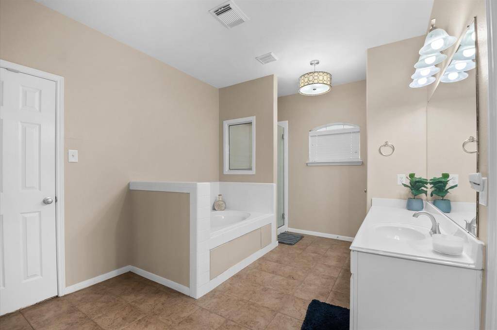 Primary bath has a private toilet & jacuzzi tub for relaxing.