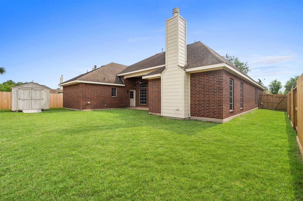 Big back yard surrounding with a new fence & storage shed