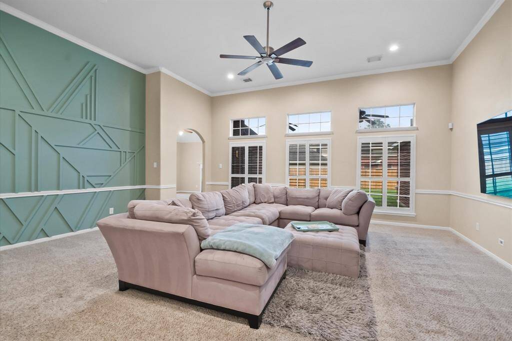 Family room with lots of space , recess lights & high ceiling
