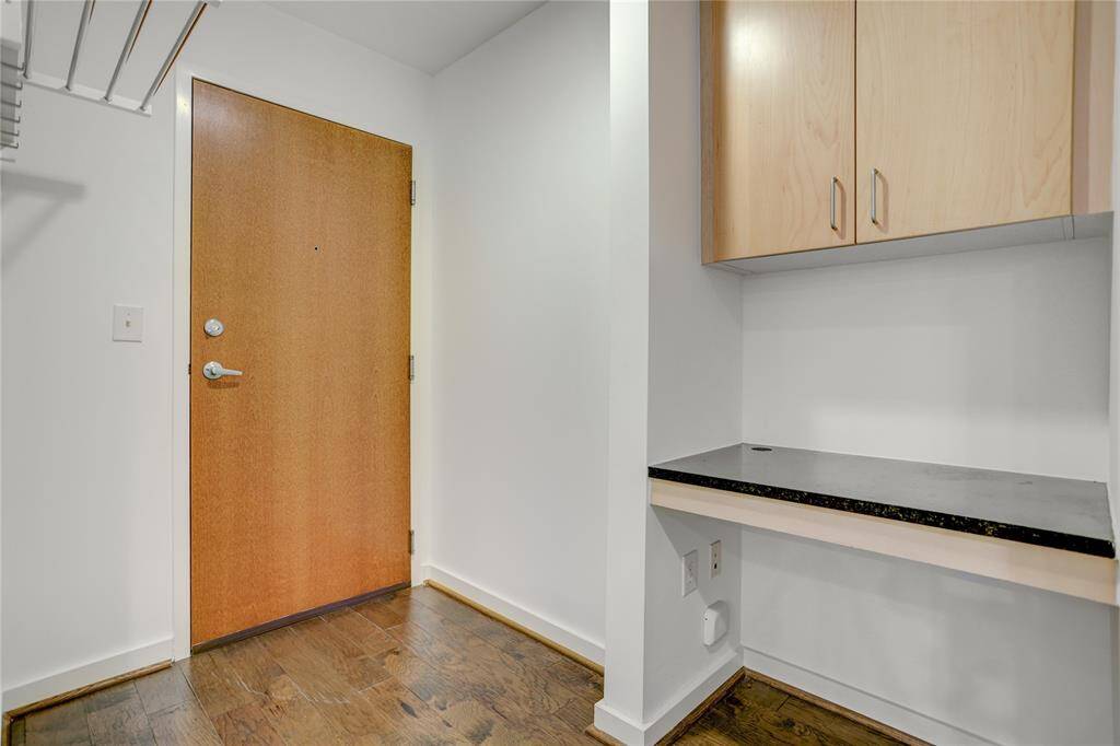 Stacked washer & dryer will convey with this condo!