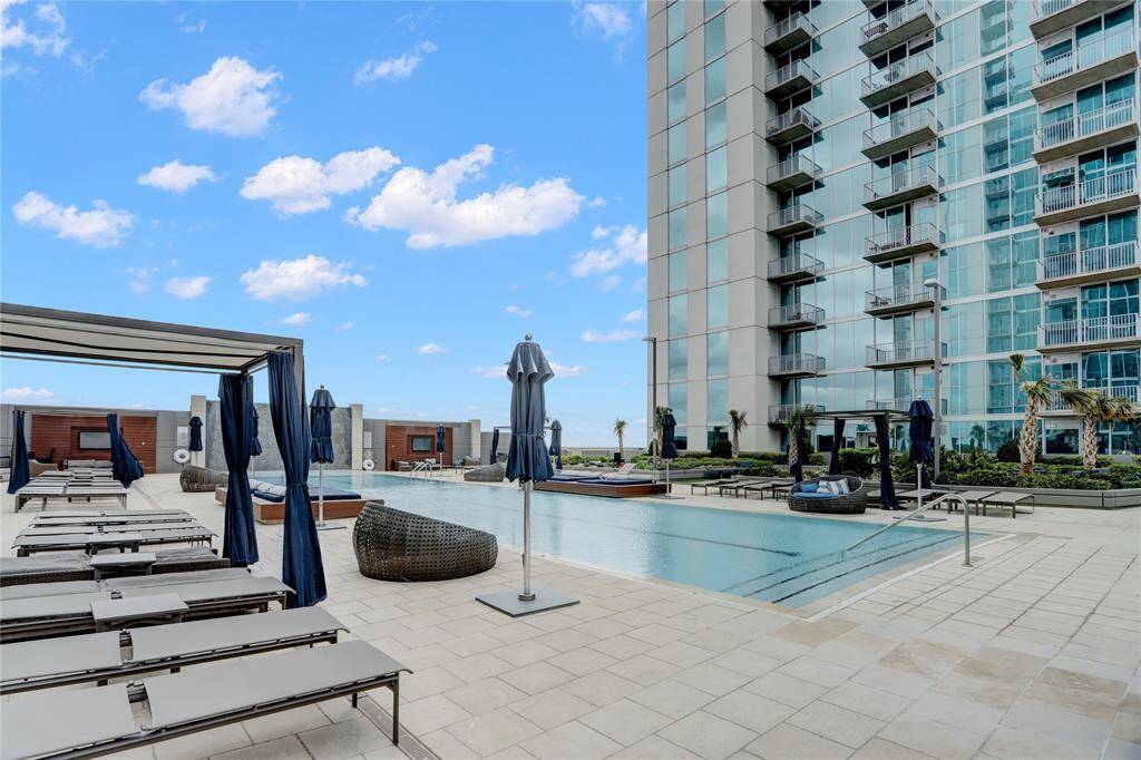 Stunning landscaping around the pool, fire pit, hot tub & outdoor grills.