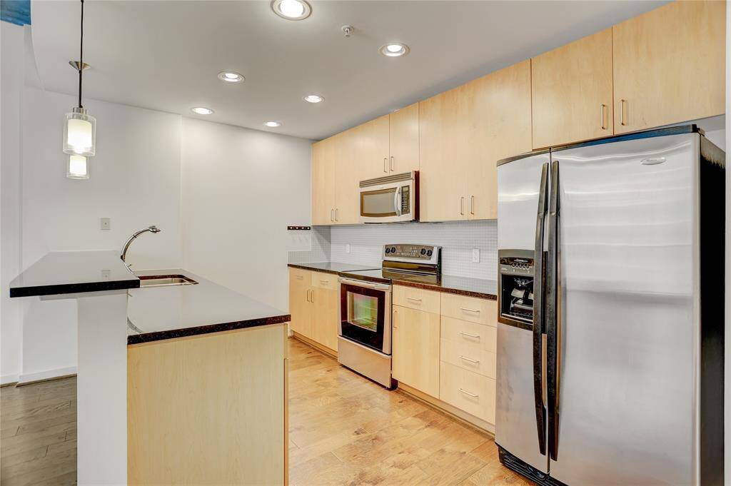 Updated kitchen with stainless steel appliances.