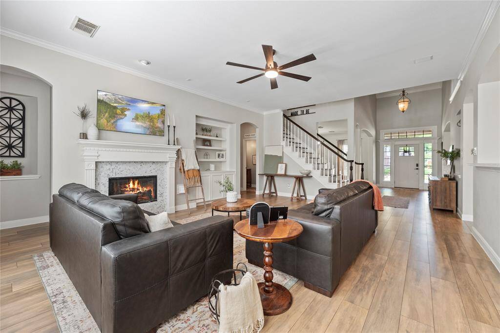 The inviting fireplace becomes a focal point that anchors the room and invites people to gather and linger, making it a cherished feature of the living area.
