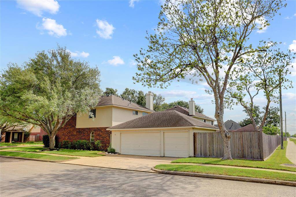 Huge corner lot with 3 car detached garage.