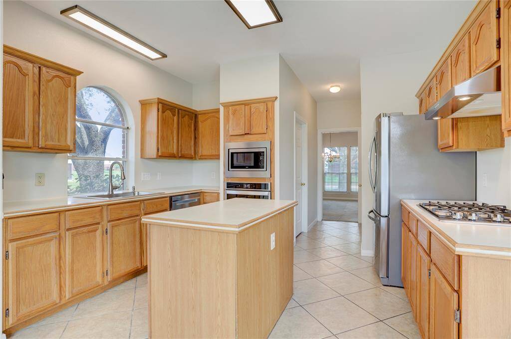 Kitchen is equipped with stainless steel appliances.