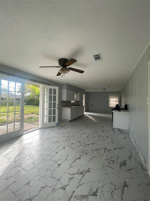 French doors in the breakfast area, adjacent to the large kitchen area.