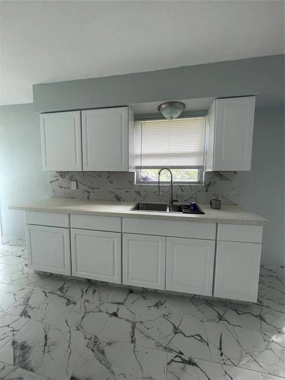 New cabinets with new counters in the kitchen.  New deep sink with new faucet.