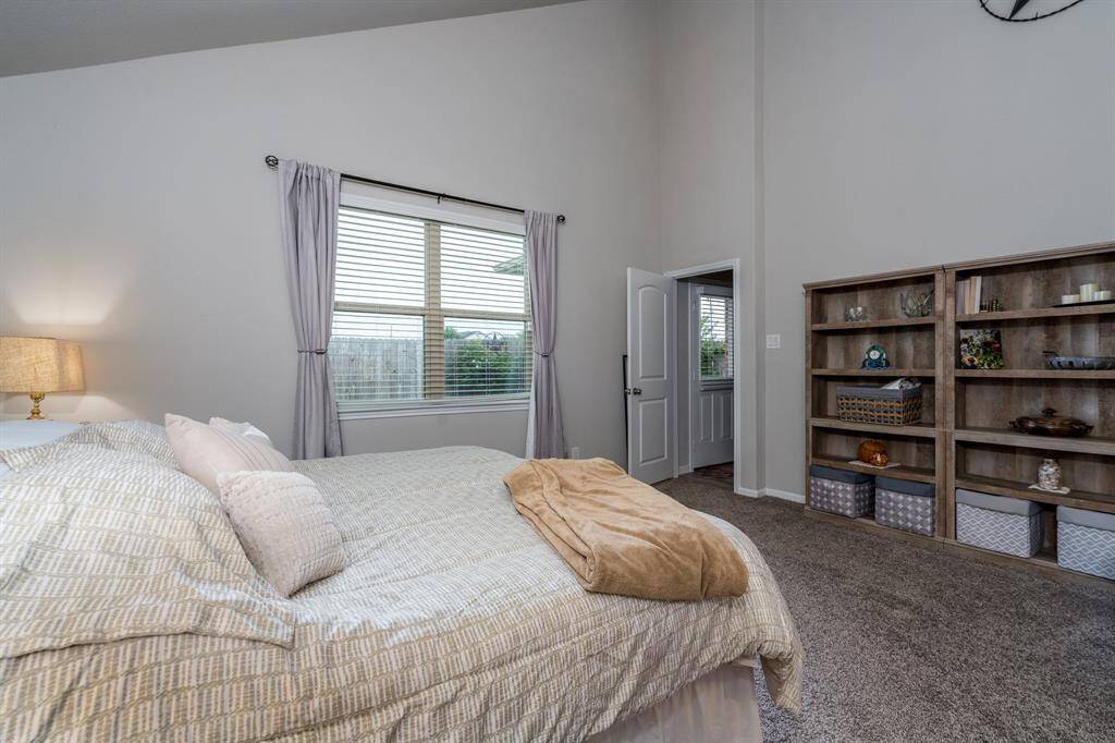 Light & bright primary bedroom is quite roomy!