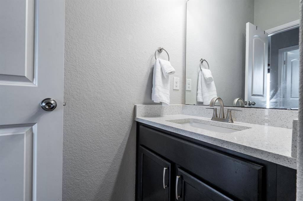 Hall bath has nice under sink storage as well.