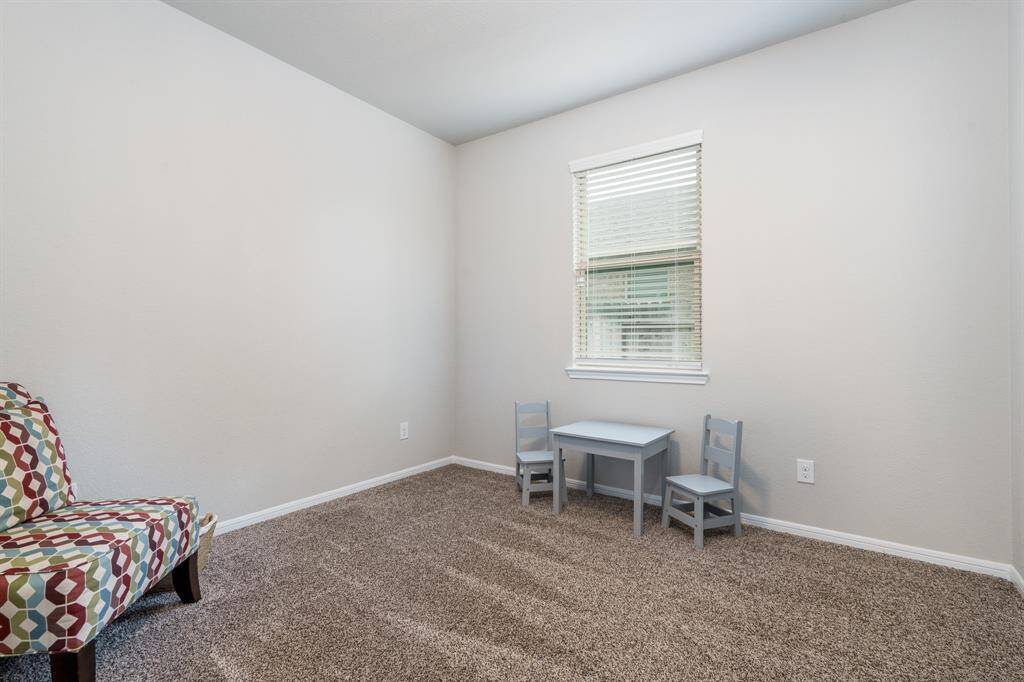 Bedroom 4 features carpet.