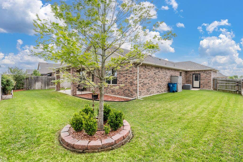 Garage has a door to the backyard for quick access!