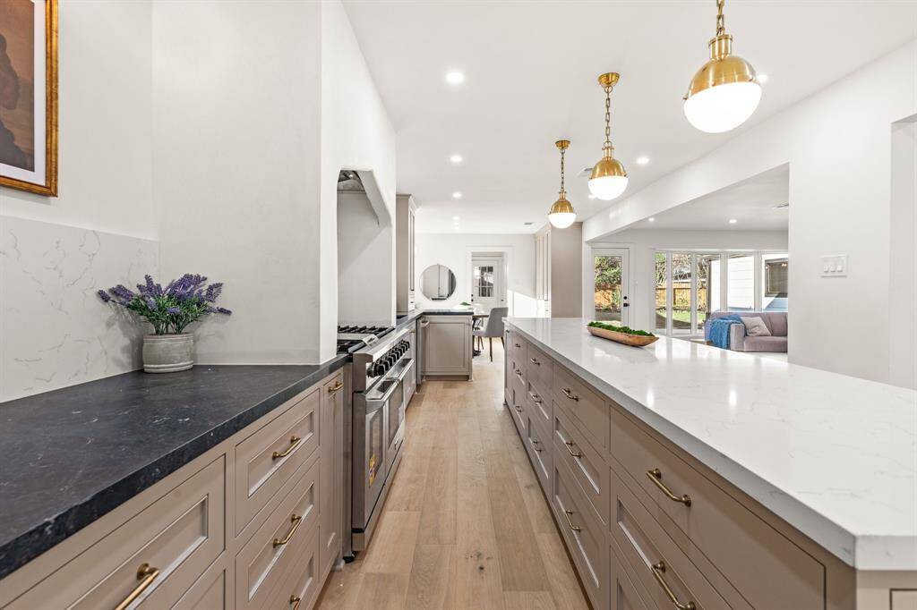 Custom built on-site, inset cabinetry offers ample storage and style.