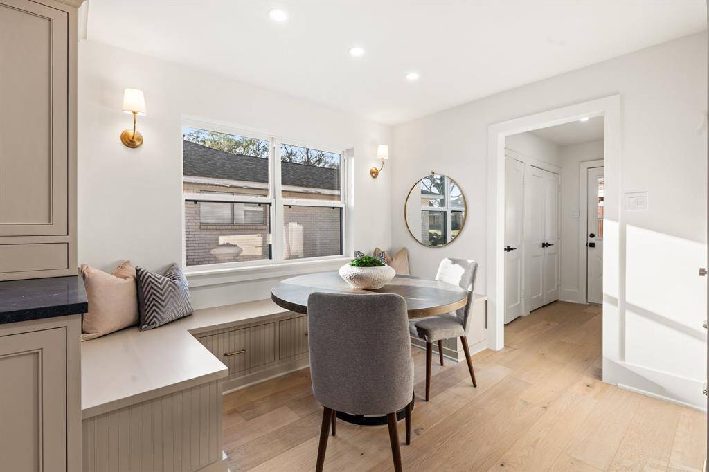 Adjacent to the kitchen, you will find a breakfast nook with a built-in bench.