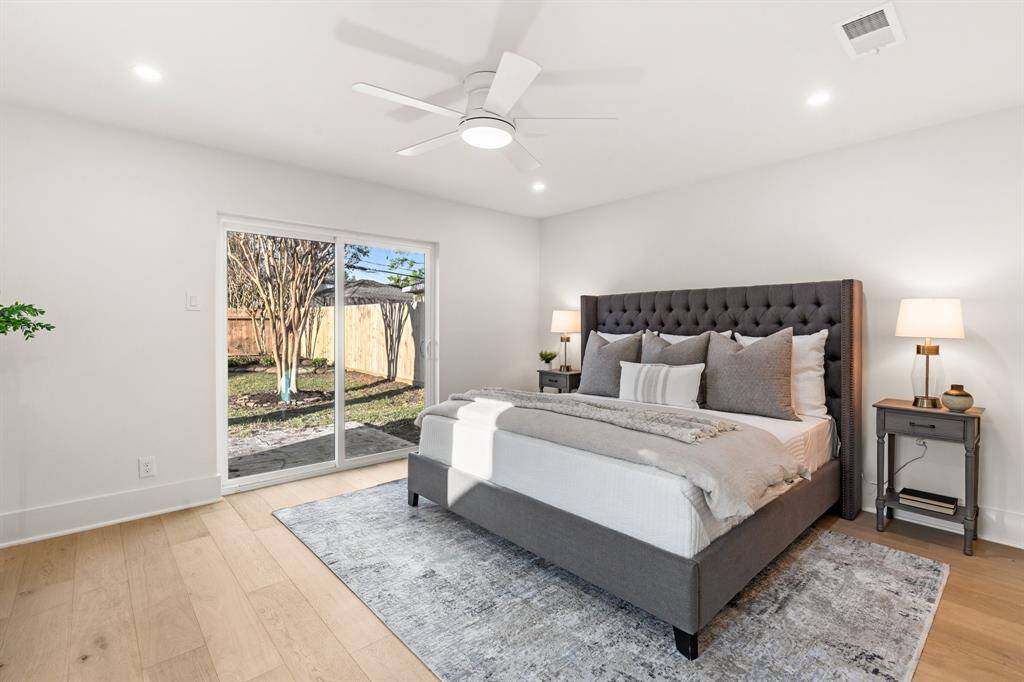 Retreat to the primary suite, a sanctuary designed for relaxation with its spacious layout and direct access to the backyard.