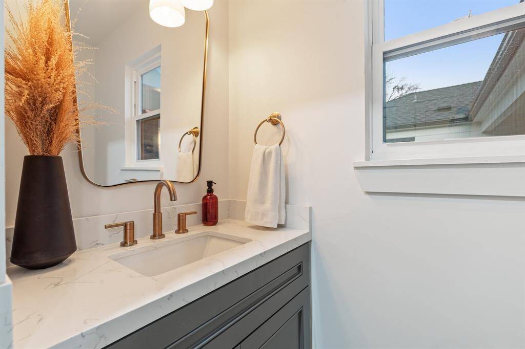 A powder room is conventally tucked away off the kitchen, perfect for guest access.