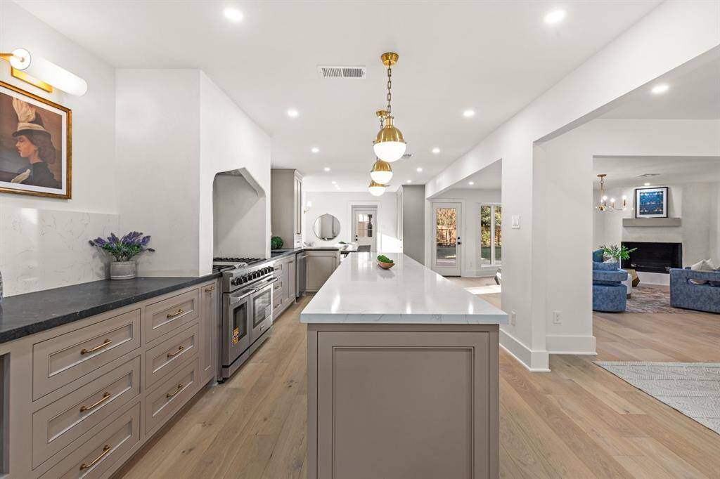 Culinary enthusiasts will delight in the high-end Thor and ZLINE appliances, complemented by soapstone and quartz countertops.