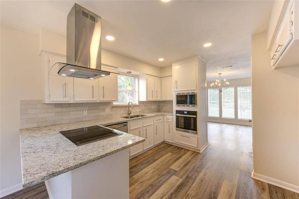 The kitchen has all new appliances, new granite counters, new backsplash, new sink and faucet, new cabinet pulls, and new LED lighting.
