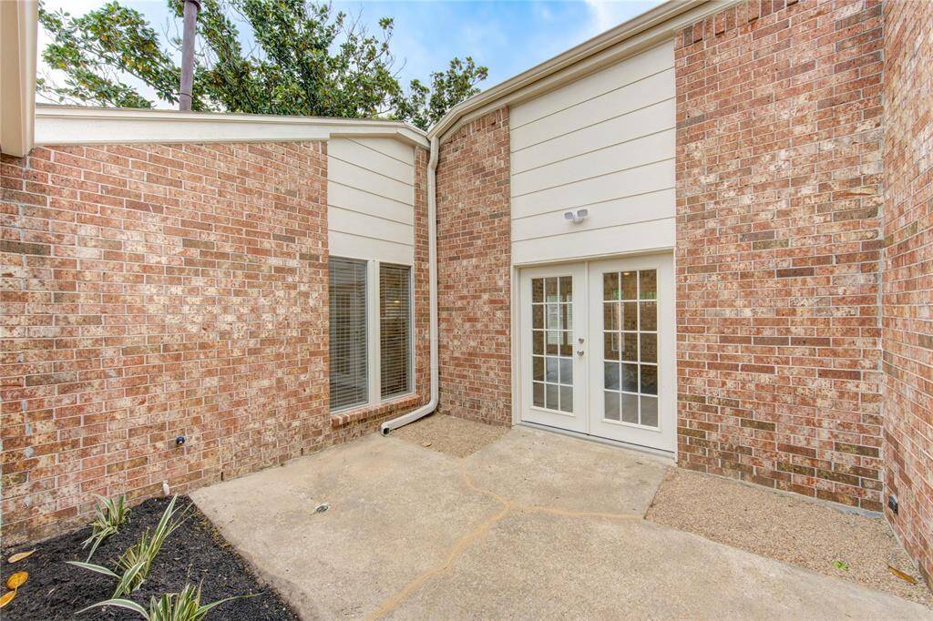 From the family room, leads out to this very nice back patio area.  This area has a lot of privacy and perfect for a patio table with umbrella.