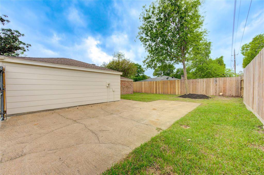 If you have a boat, RV, trailer, or just want an additional concrete slab for a large patio, then you'll love this back yard!  Even a basketball court would be cool!  There is a large dual gate that opens to the massive driveway on the other side.  It is large enough to drive a vehicle through.  Also, it is worth mentioning that the privacy fence is 8ft tall (not the typical 6ft fence).  This is a nice feature!