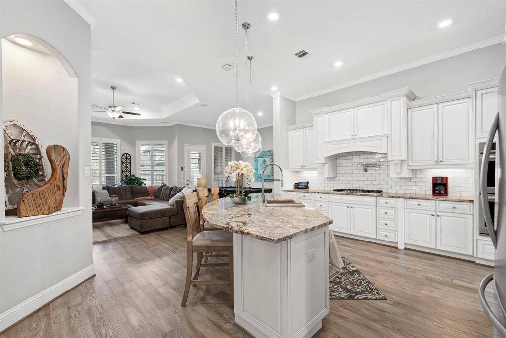 Spacious open kitchen with expansive island! This stunning open kitchen is the heart of the home, featuring a large island perfect for meal prep, entertaining, or casual dining. With ample counter space and a seamless flow into the living and dining areas.