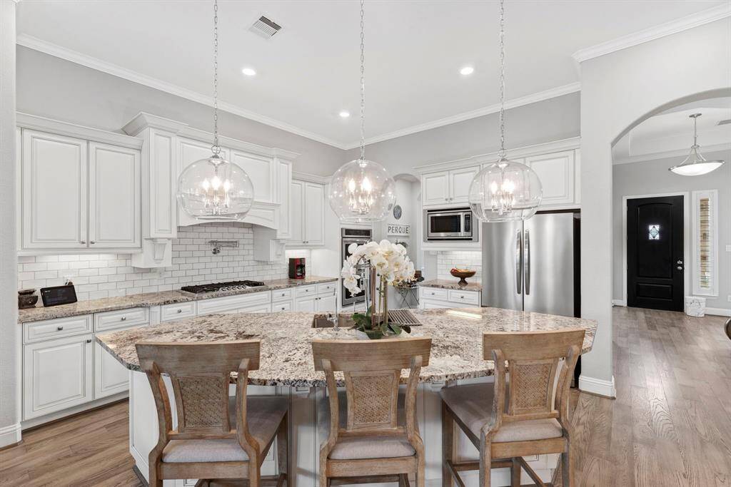 Enjoy the luxury of a chef-inspired kitchen featuring double ovens and built in microwave.