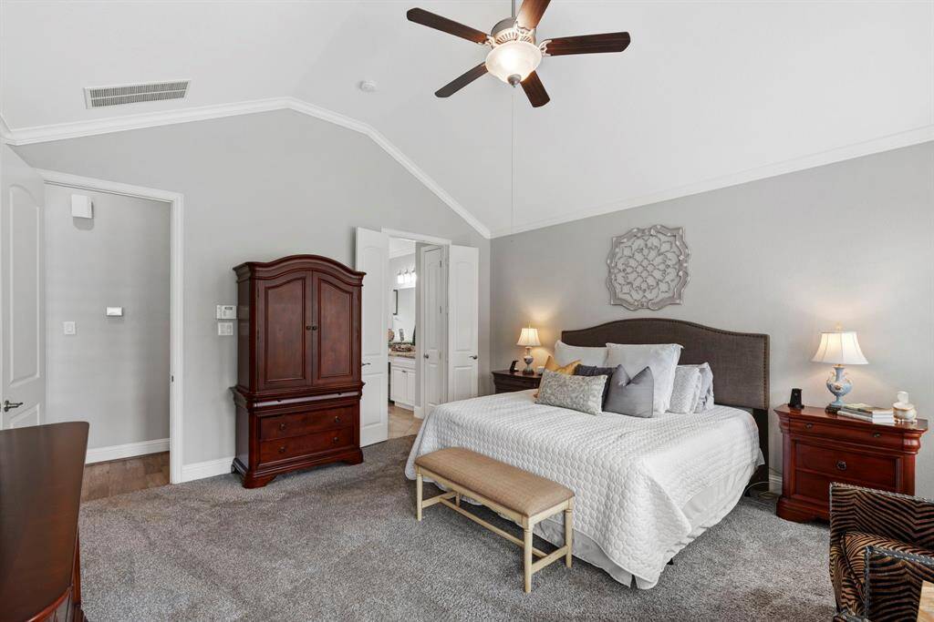 A luxurious retreat where every detail speaks of refined elegance. Fine crown molding frames the room with timeless sophistication, creating a setting that is inviting.