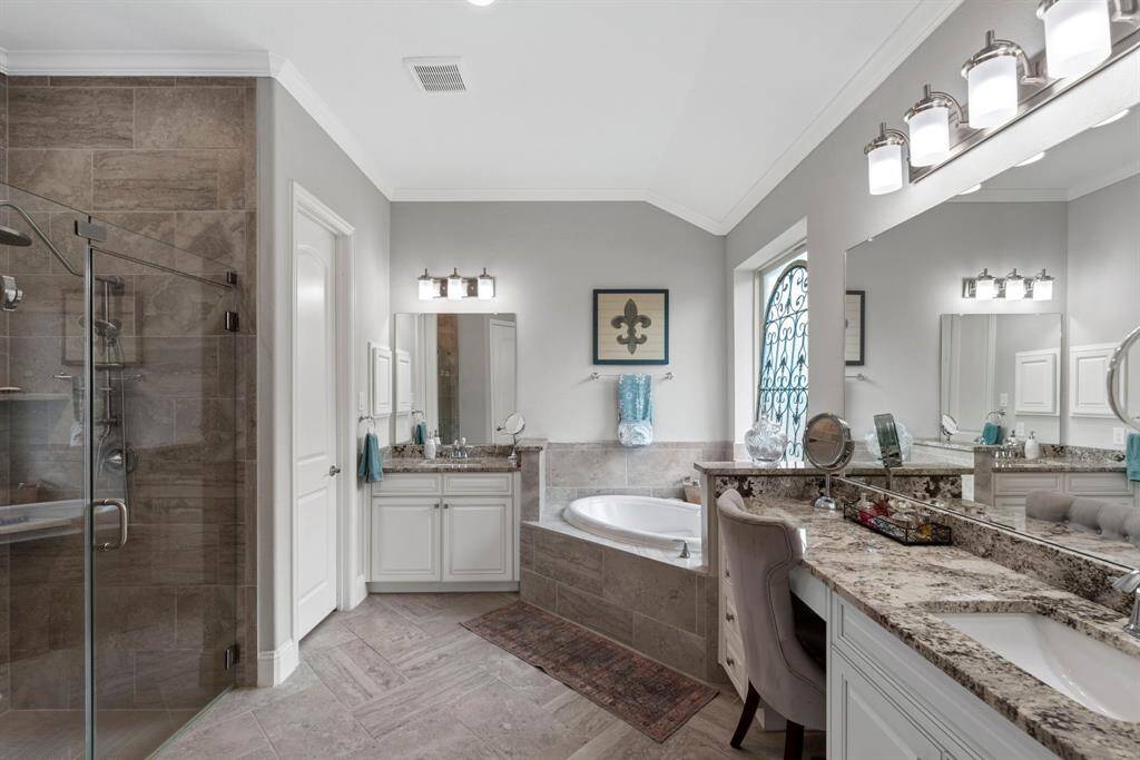 Beautifully designed primary bathroom. Featuring a spacious layout, elegant finishes, and a serene ambiance.